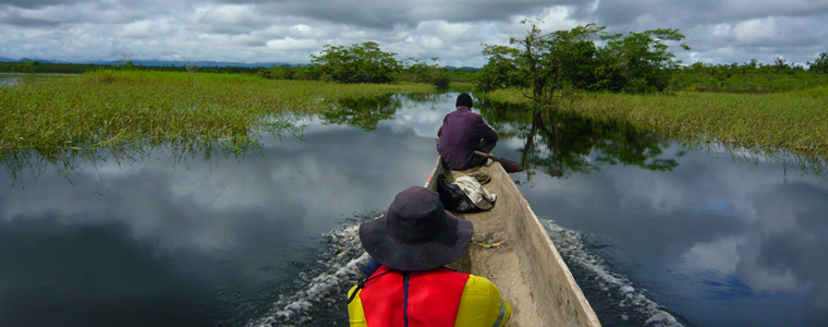 Canoe in river channel